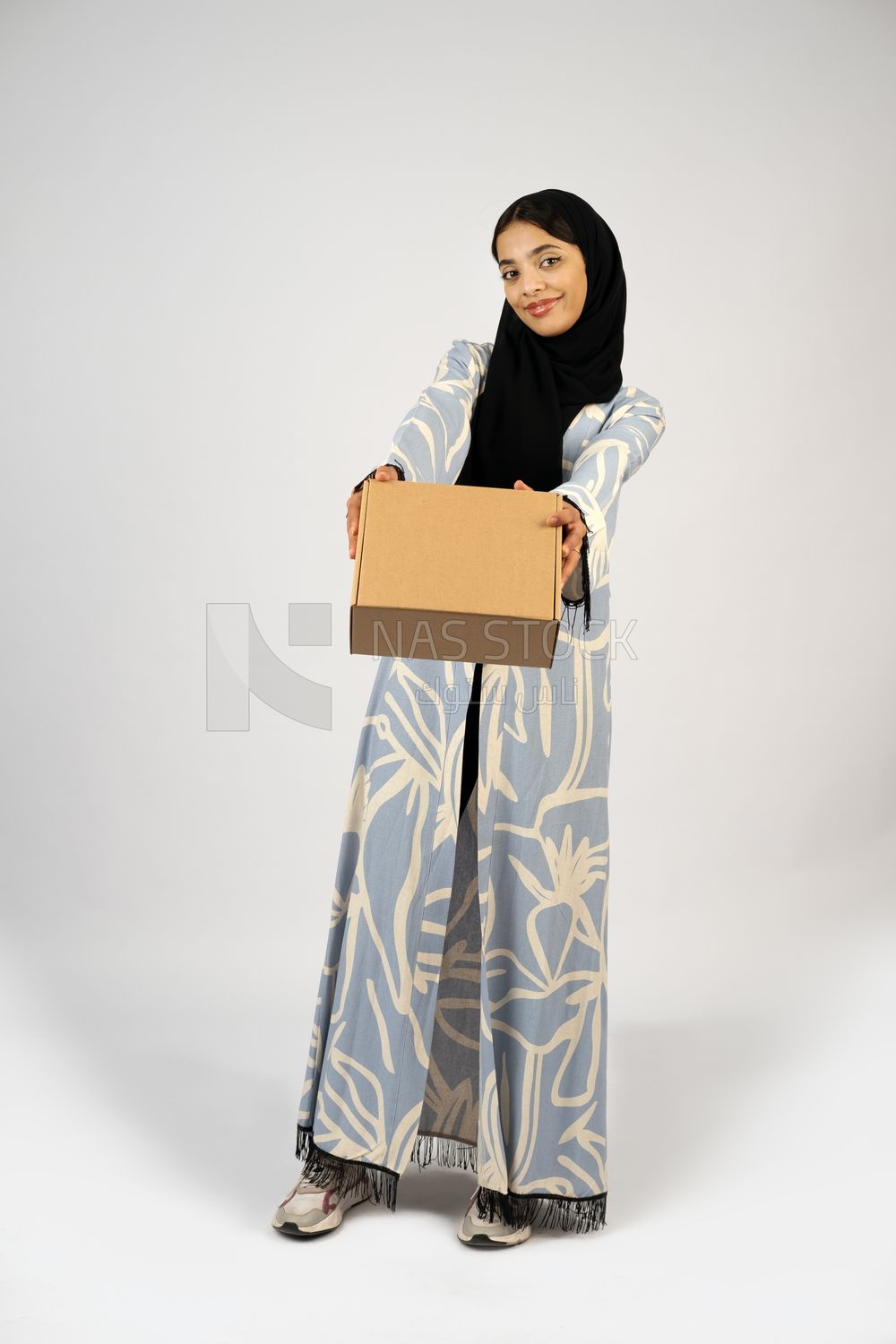 Gulf girl holding a special order box