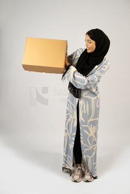 Gulf girl holding a special order box