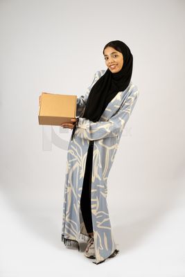 Gulf girl holding a special order box