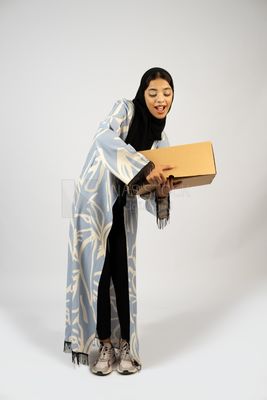 Gulf girl holding a special order box