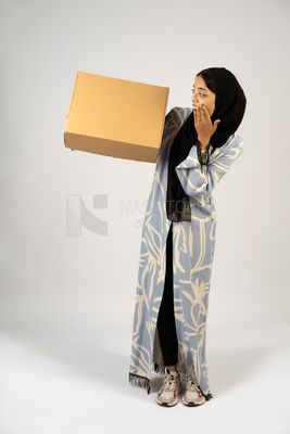 Gulf girl holding a special order box