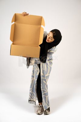 Gulf girl holding a special order box