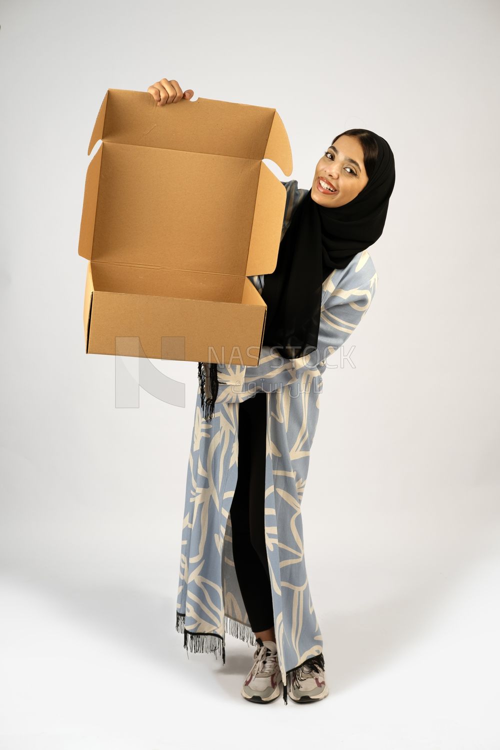 Gulf girl holding a special order box