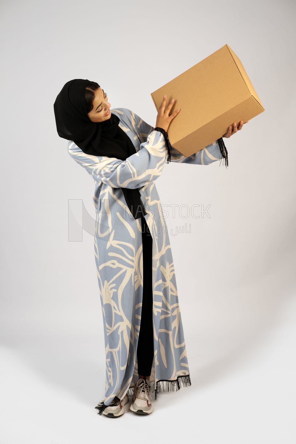 Gulf girl holding a special order box