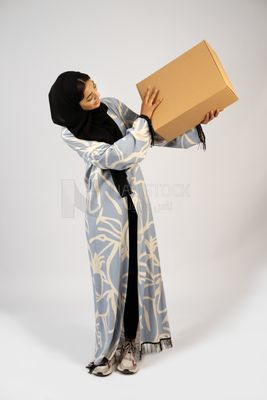 Gulf girl holding a special order box