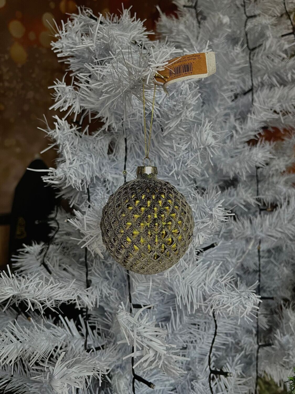 Boule de Noël effet neige pailletée vert pomme de pin