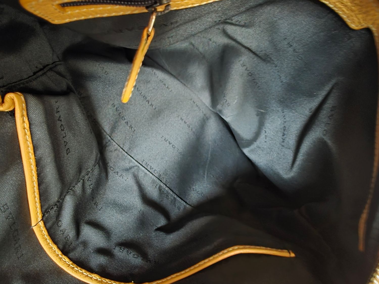 Bvlgari embossed slogan leather bag