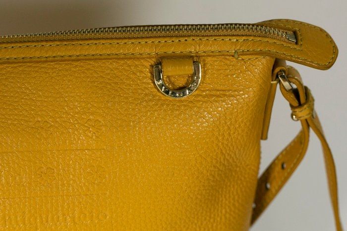 Bvlgari embossed slogan leather bag