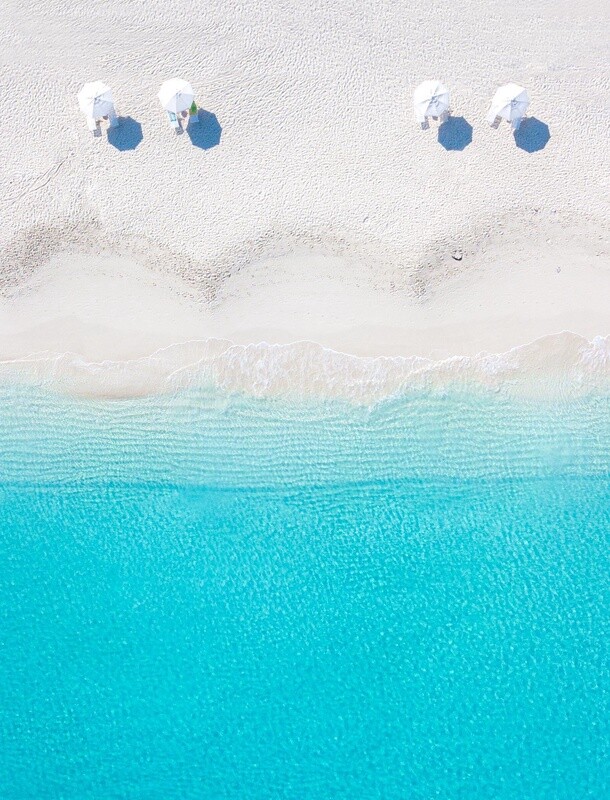 Four White Umbrellas