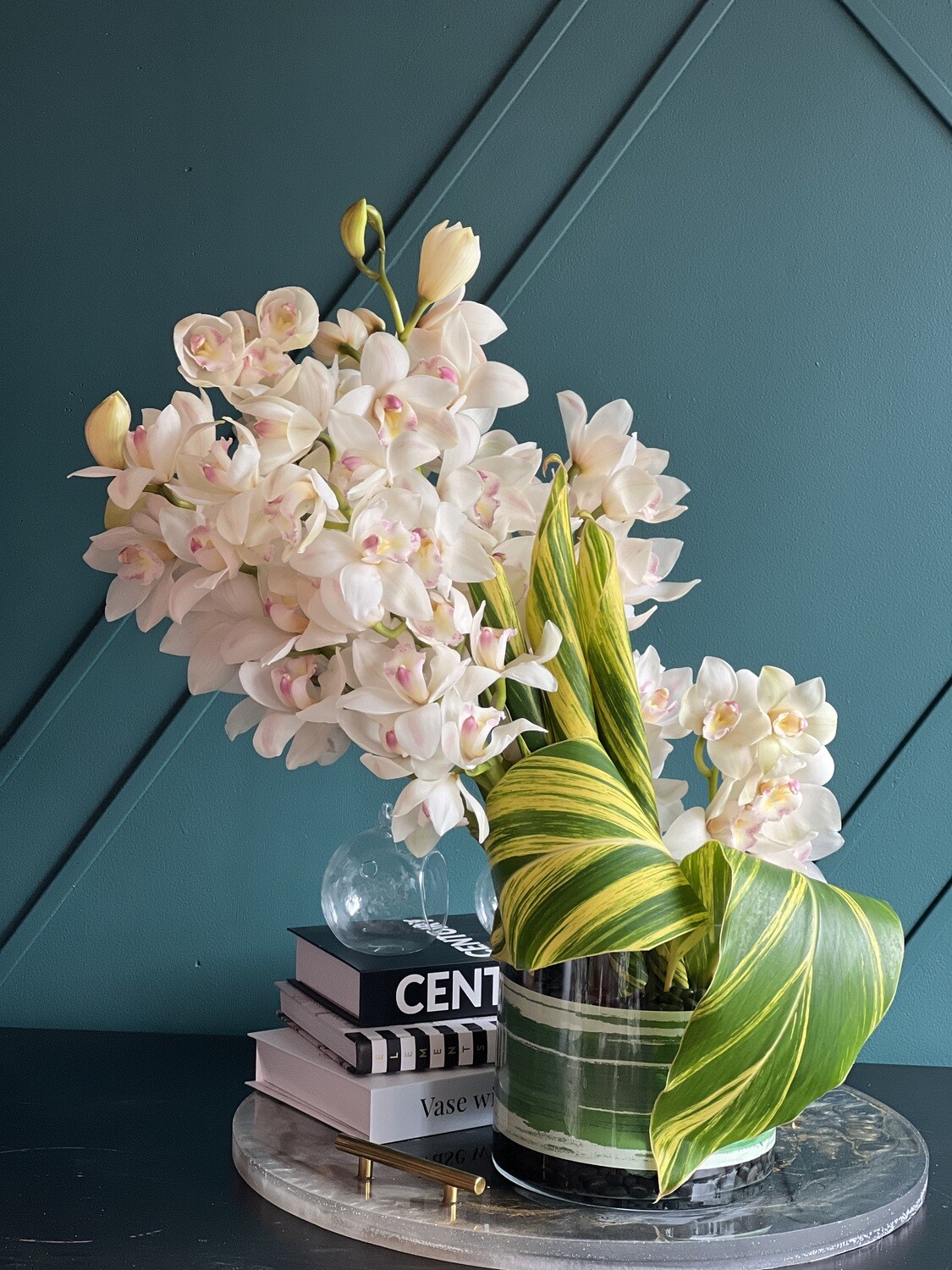 Cymbidium Orchids In Vase. Modern Flower Design