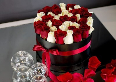 RED AND WHITE ROSES DESIGNED IN A ROUND BOX