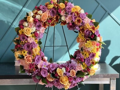 Vibrant multi-colored sympathy wreath