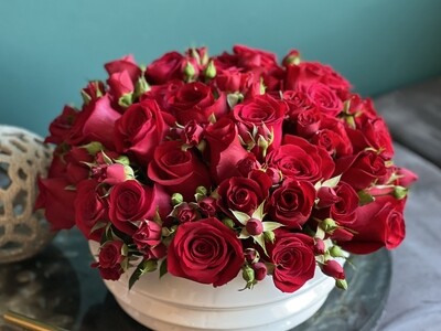 50 Red Roses and mini roses  in a ceramic vase