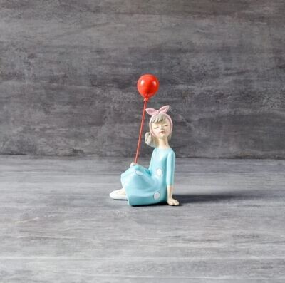 Erlina Sitting with a Balloon