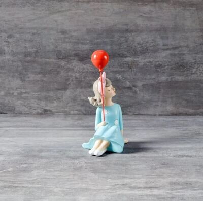 Erlina Sitting with a Balloon