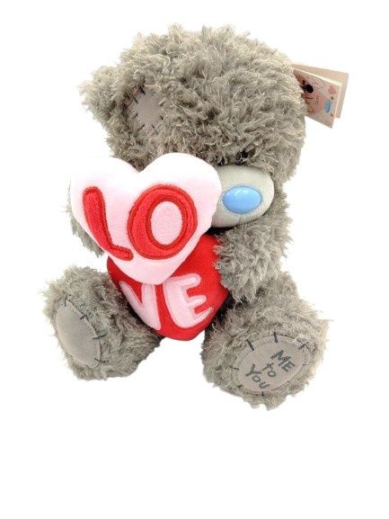 Tatt Ted Holding two Love Hearts