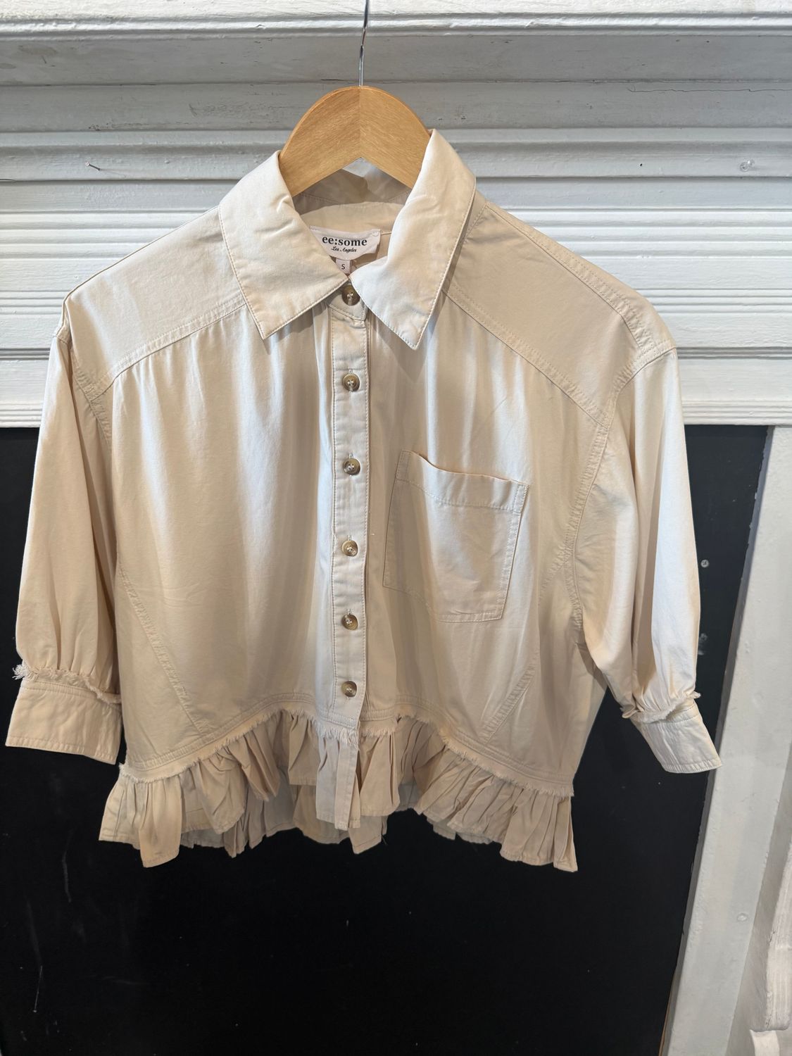 Bone Ruffle Hem Top