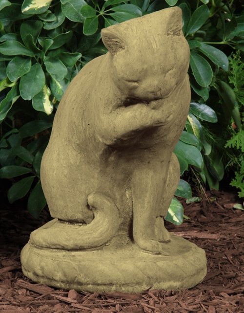 Stone Cat Licking Paw