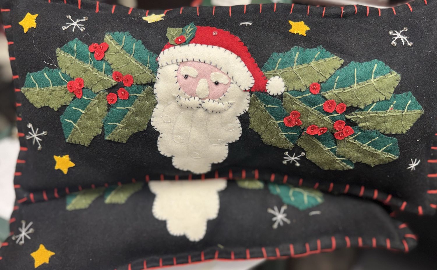 Santa with Holly on a Black Pillow