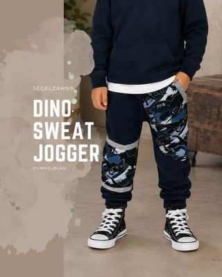 Kinder Jogginghose mit Dinosaurier Motiv | Slim Fit Mitwachshose Dunkelblau | French Terry Kinder Slim Fit Sweat Hose in Dunkelblau mit Dinosaurier-Motiv, Dino-Seitentasche und grauen Mitwachsbündchen