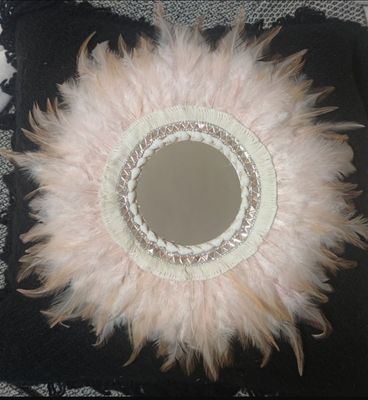 Espejo de plumas infantiles