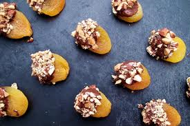Apricots Covered In Chocolate With Nuts