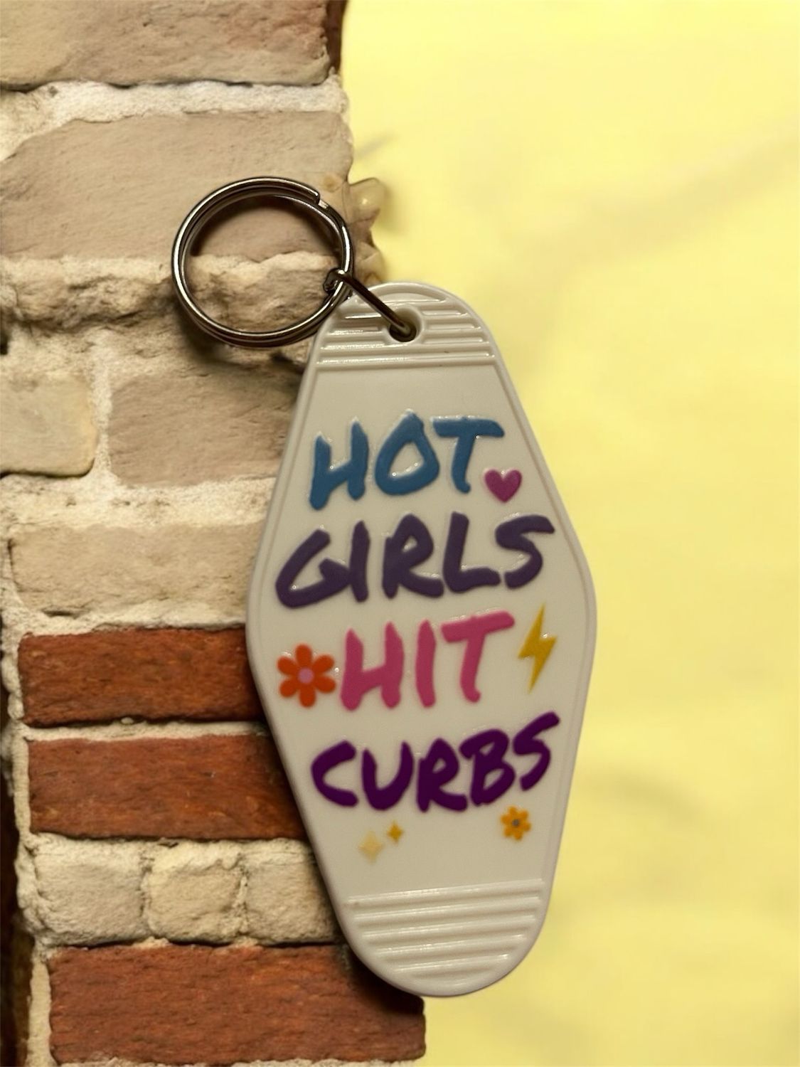 Hot Girls Hit Curbs Hotel Keychain