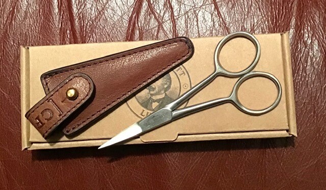 Beard scissors in leather pouch