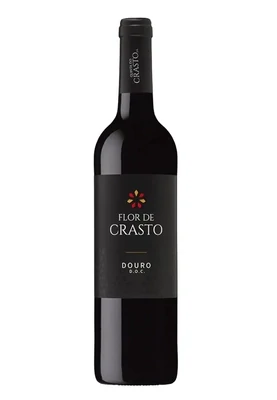 Garrafa clássica do Vinho Tinto Flor de Crasto com rótulo preto e dourado, apresentando o brasão da família Crasto.