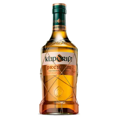 Garrafa de Klipdrift Premium Brandy — brandy sul-africano de coloração âmbar, sobre fundo neutro