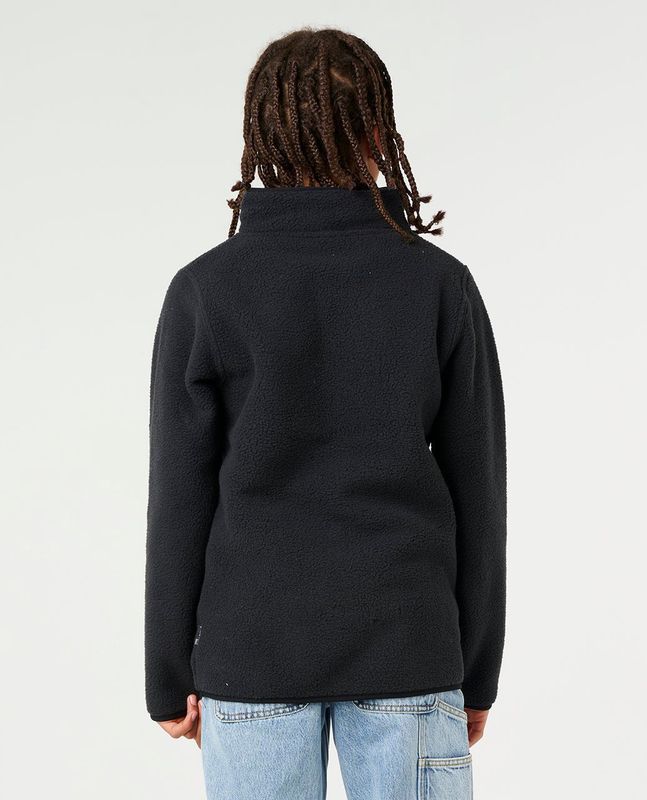 Bacl view of a boy wearing the black Bells polar fleece by Ripcurl