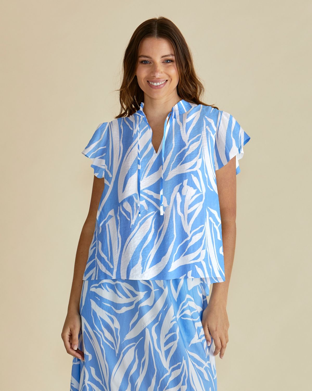 Betty Basics Lyra Blouse in Blue/White Abstract Print, Women's short sleeve cotton blend summer top with tie neckline.