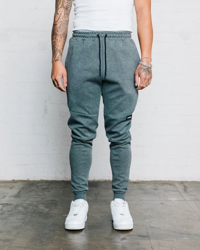 Mens dark grey tracksuit pants with a elastic waist band with a black draw string 
