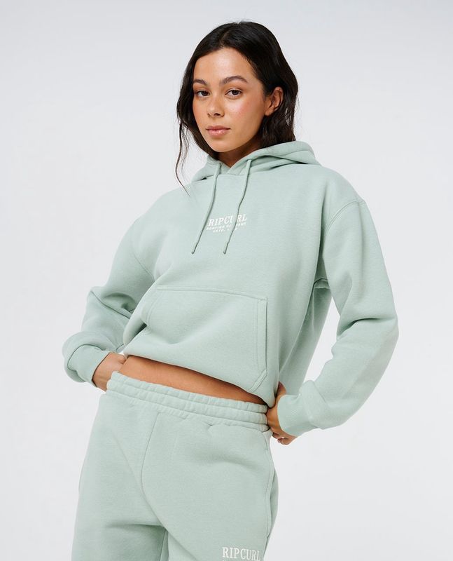 women wearing hood showing the draw string detailing kangaroo pocket and embroidered logo