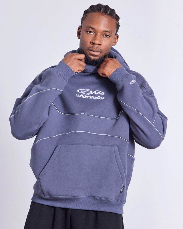 WNDRR GLOBE PANEL HOOD SWEAT in STORM BLUE and grey tubing. Oversized fit wth hood and cuffed sleeves and waistband