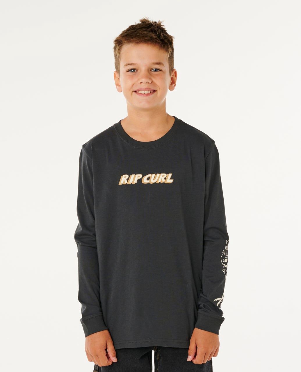 Boy wearing washed black Eternal long sleeve by ripcurl featuring a printed ripcurl logo and graphics on sleeve 