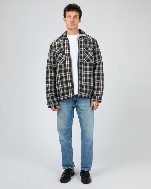 Man wearing the Hamilton check jacket matched back with a white t-shirt and blue jeans 