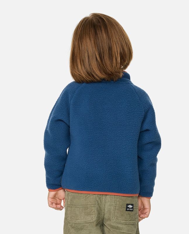 Back view a boy wearing the  Heritage Polar Fleece By RipCurl featuring a navy n\blue colour