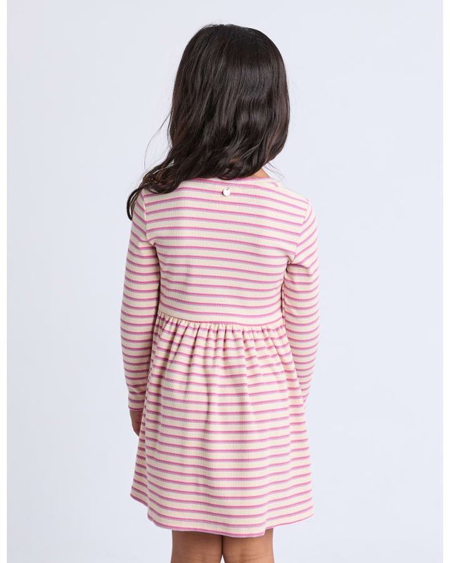 Back view of a girl wearing the Eve Girl Maya Rib Dress in pink stripe in a long sleeve