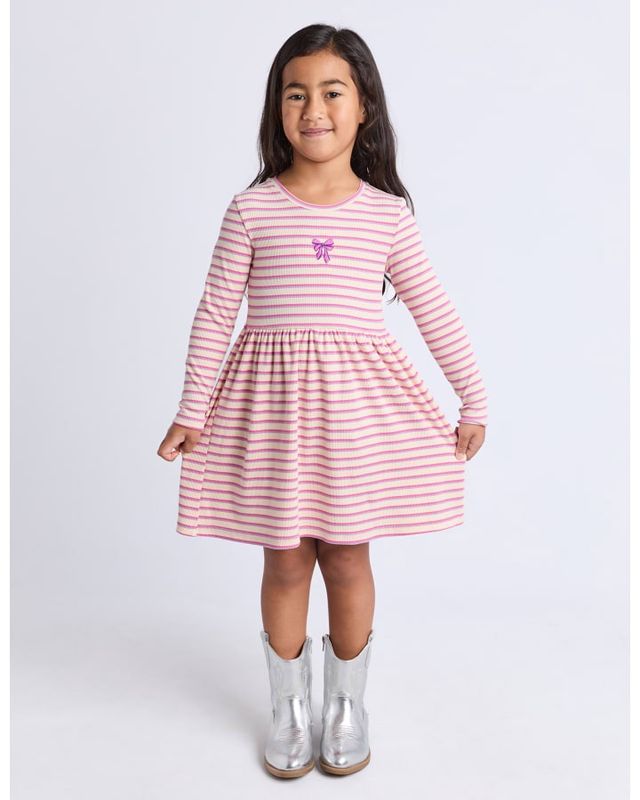 girl wearing the Eve Girl Maya Rib Dress featuring pink stripes and an embroidered bow
