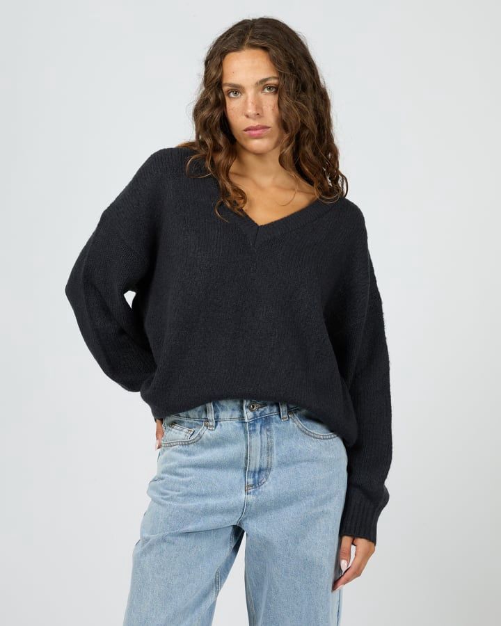 Women wearing the Silent Theory Elia Chunky Knit Jumper in Navy featuring an oversize fit with a v neck line