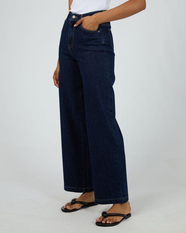 close view of a womens wearing the All About Eve Jacqui Wide Leg in Indigo. A 99% cotton and 1% elastane pant that is comfort