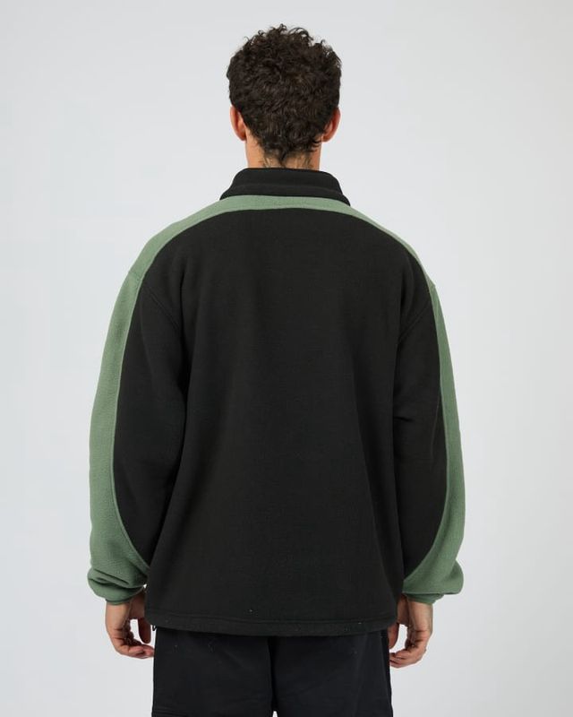 Back view of a male model wearing Hyperdrive Polar Fleece Jacket by St Goliath, featuring the high collar 