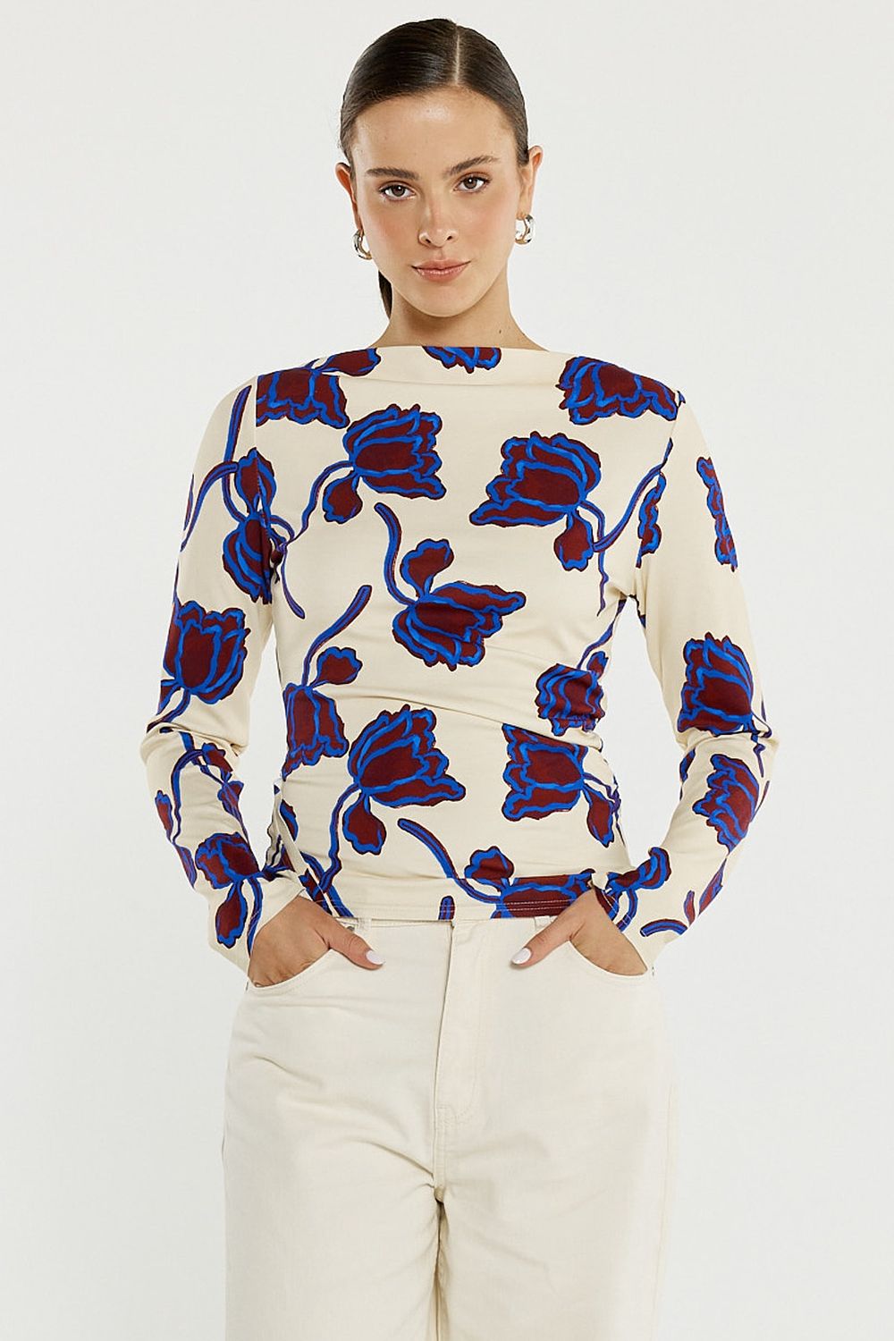women wearing the Sass Jade Seamed Jersey Top a tight fitting long sleeve top with winter poppies in it