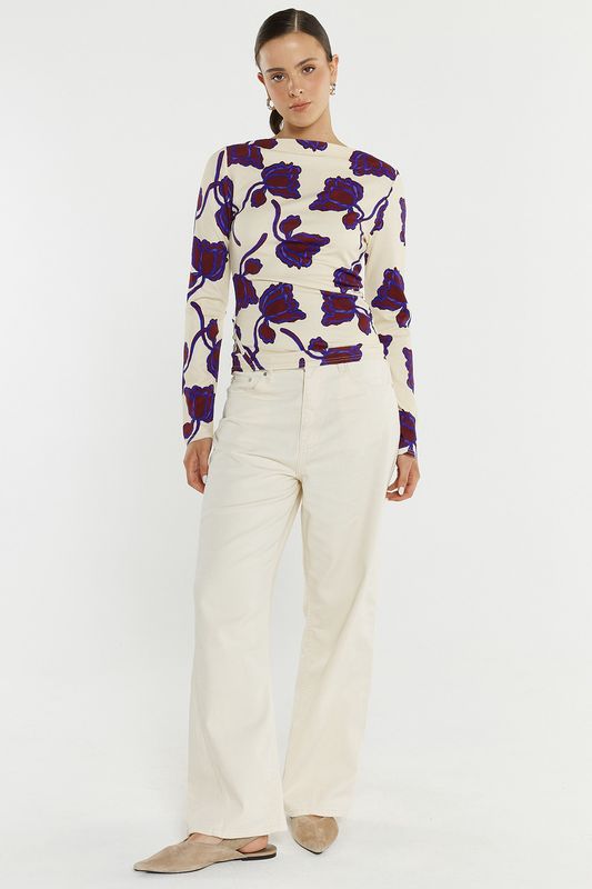 full length view of women wearing the Sass Jade Seamed Jersey Top with cream jeans