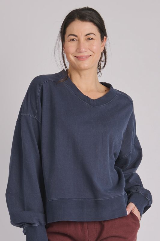 Close up of the V Neck Boxy Crew in Indigo showing the washed blue colour and style 