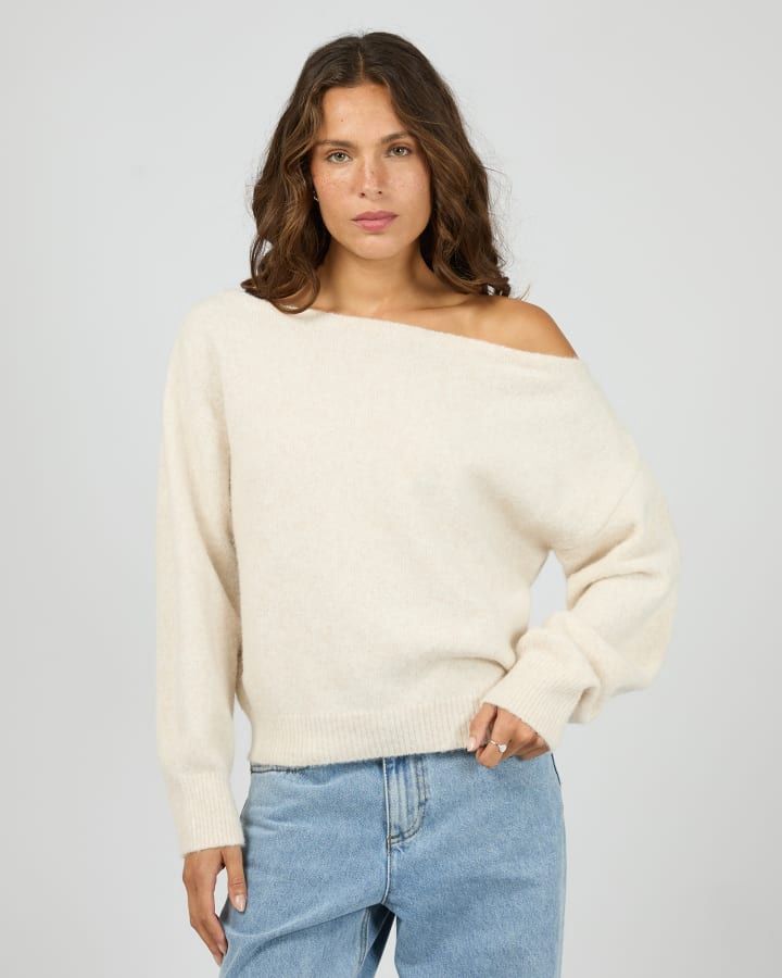 Womens wearing the Off Shoulder Silent Theory featuring a knit that is off the shoulder in oat