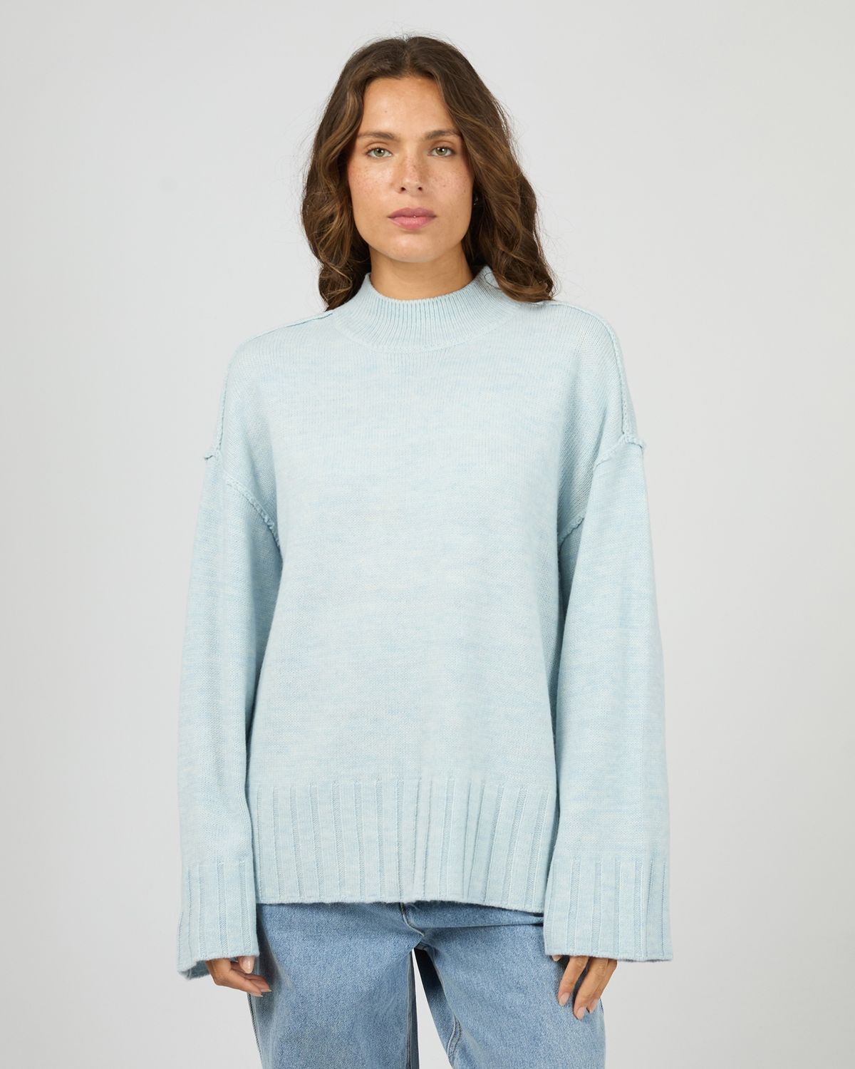 Women wearing the Silent Theory Lotus knit showing the detailing and the light blue colour 
