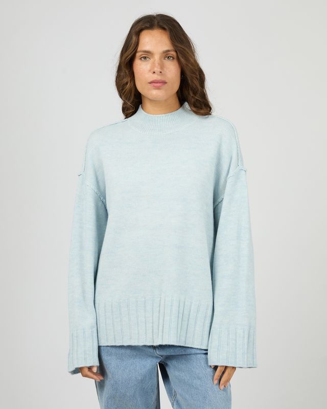 Women wearing the Silent Theory Lotus knit showing the detailing and the light blue colour 