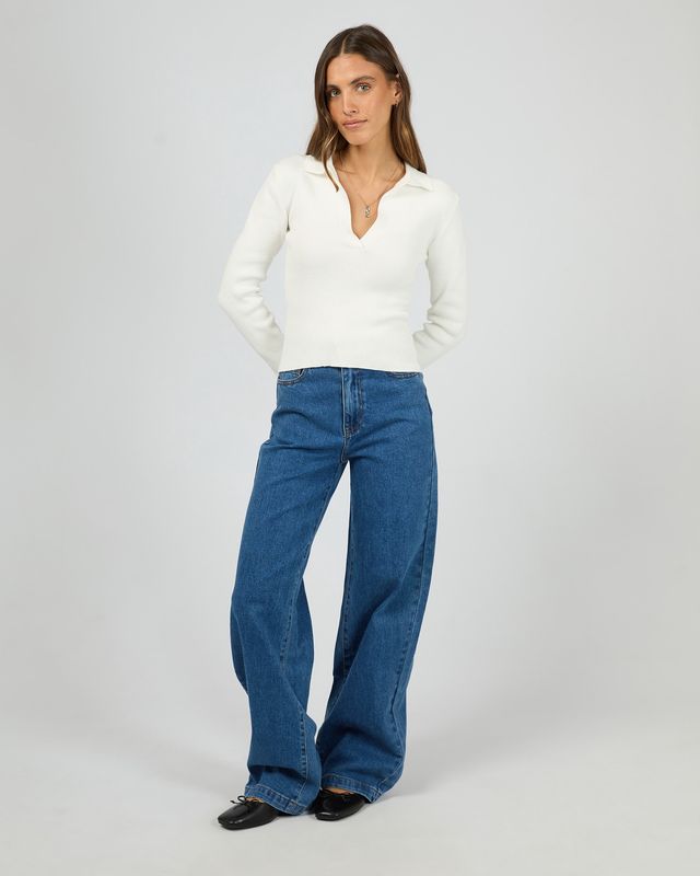 full length view of the All About Eve Cecilia Knit in vintage white paired with blue jeans 